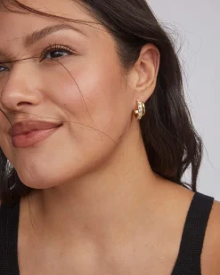 Livy Gold Huggie Earrings in White Crystal